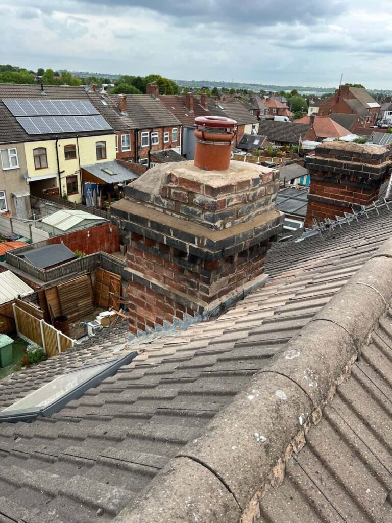 This is a photo taken from a roof which is being repaired by East Grinstead Roofing Repairs, it shows a street of houses, and their roofs